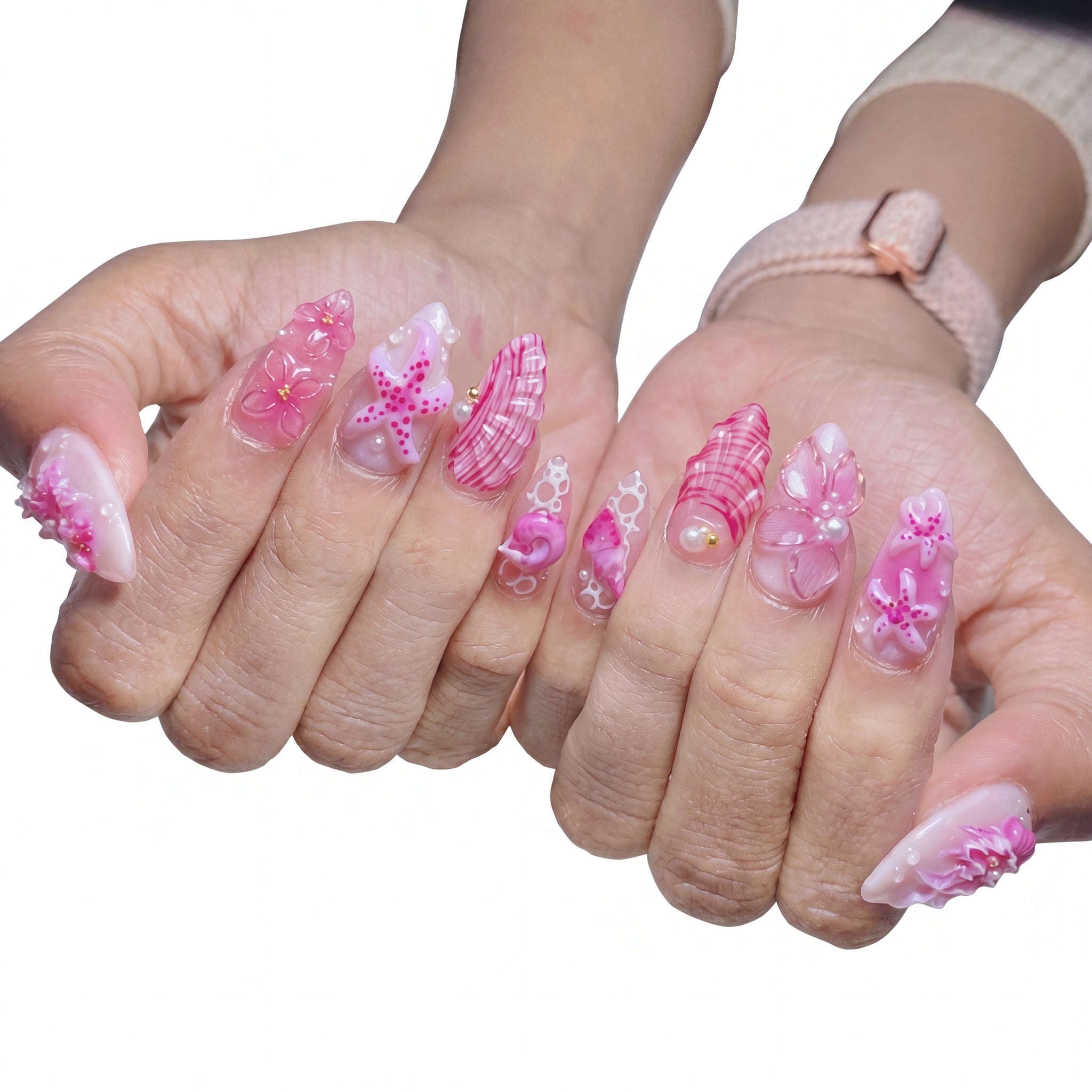 Pink Reef press-on nails on hand