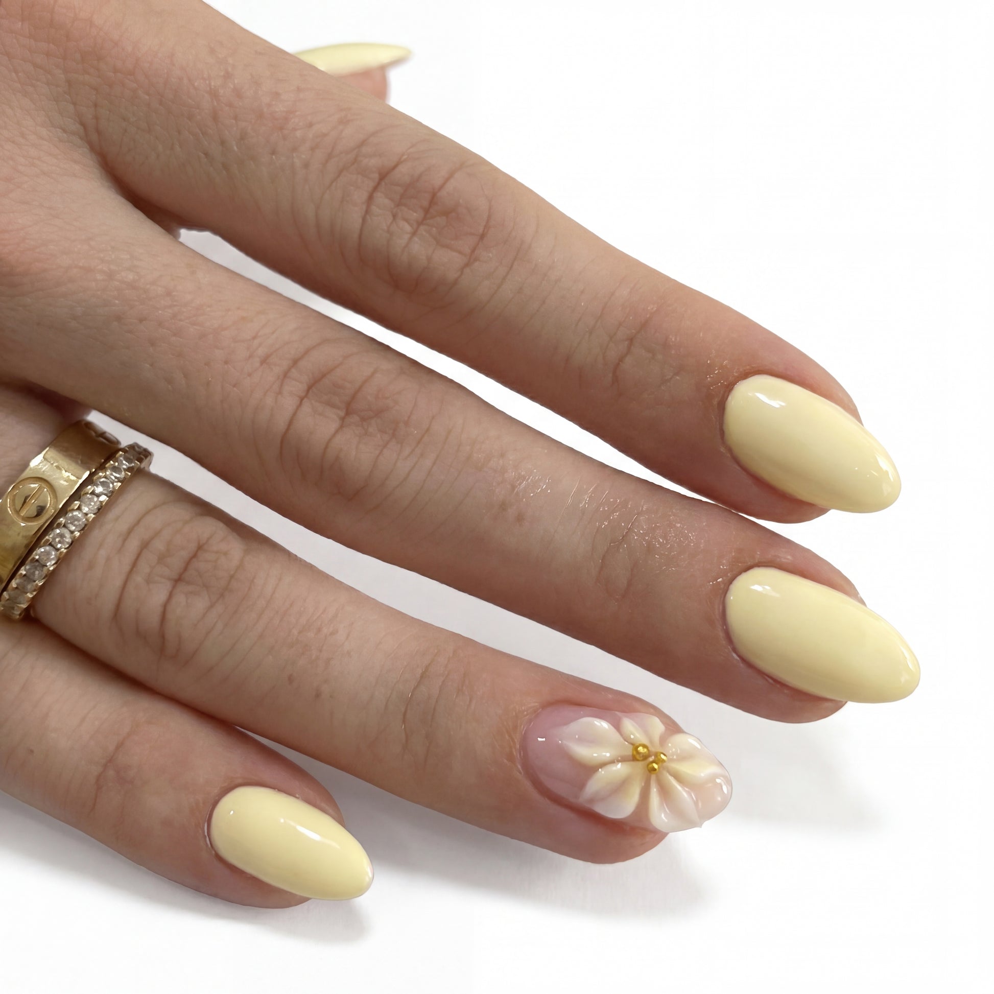 Lemon Petal press-on nails on hand