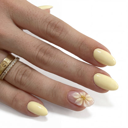 Lemon Petal press-on nails on hand
