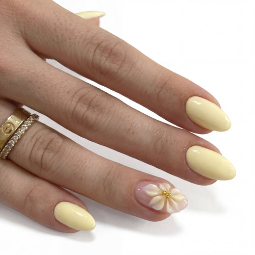 Lemon Petal press-on nails on hand