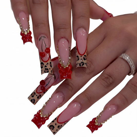 Cherry Bow Leopard press-on nails on hand