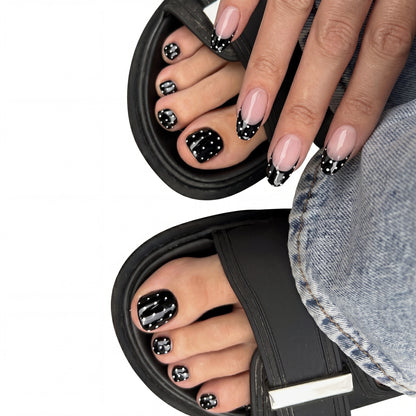 Black Polka French toe press-on nails on feet