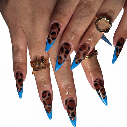 Blue Leopard Stiletto press-on nails on hand