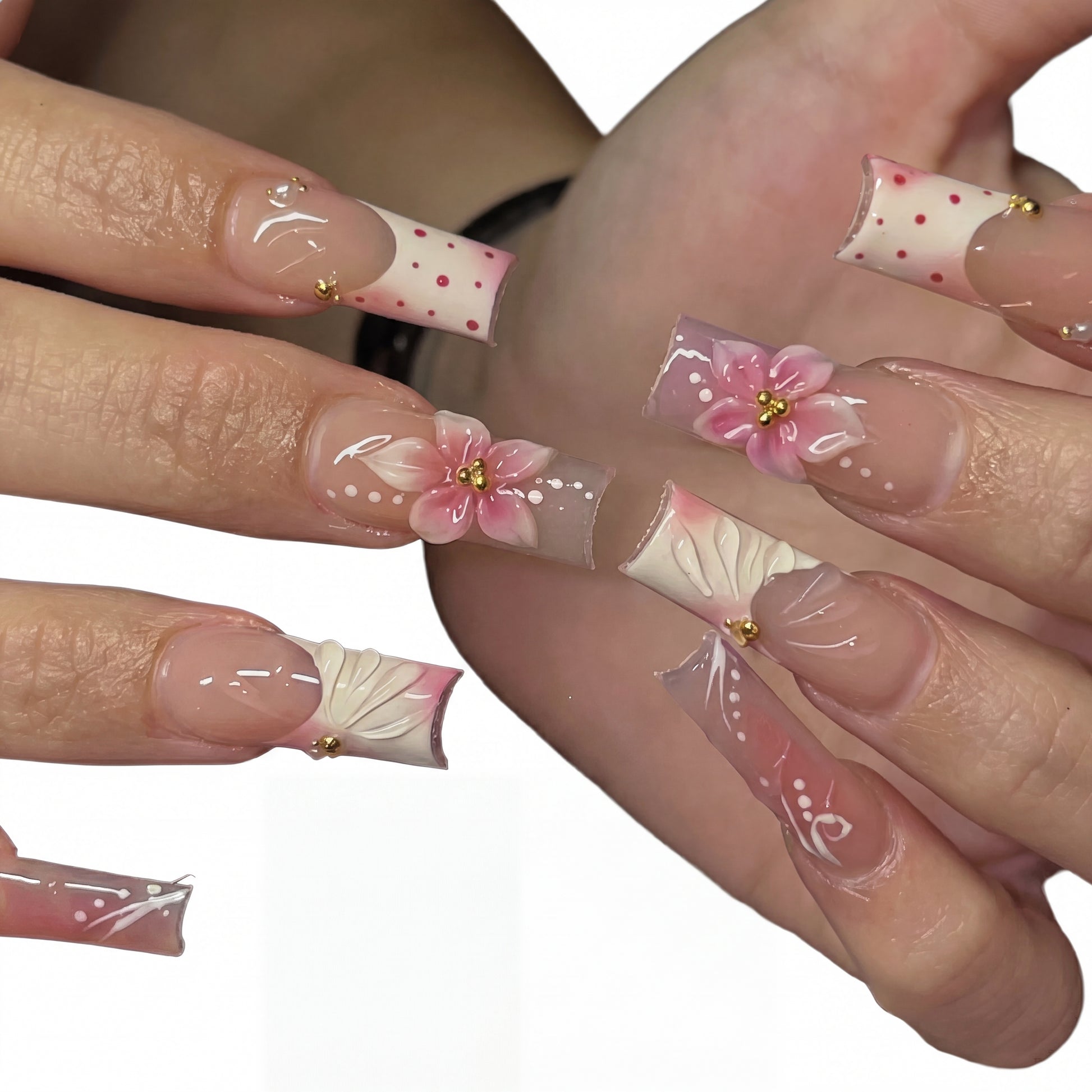 Dotted Blossom press-on nails on hand