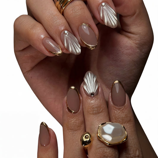 Mauve Shell press-on nails on hand