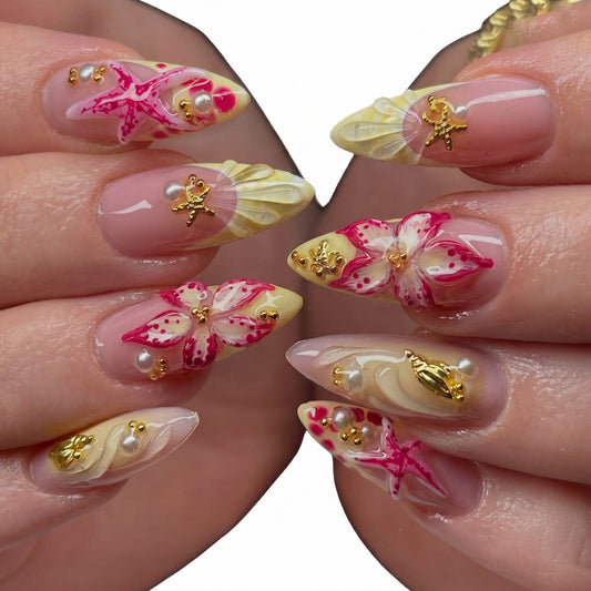 Sunset Starfish press-on nails on hand