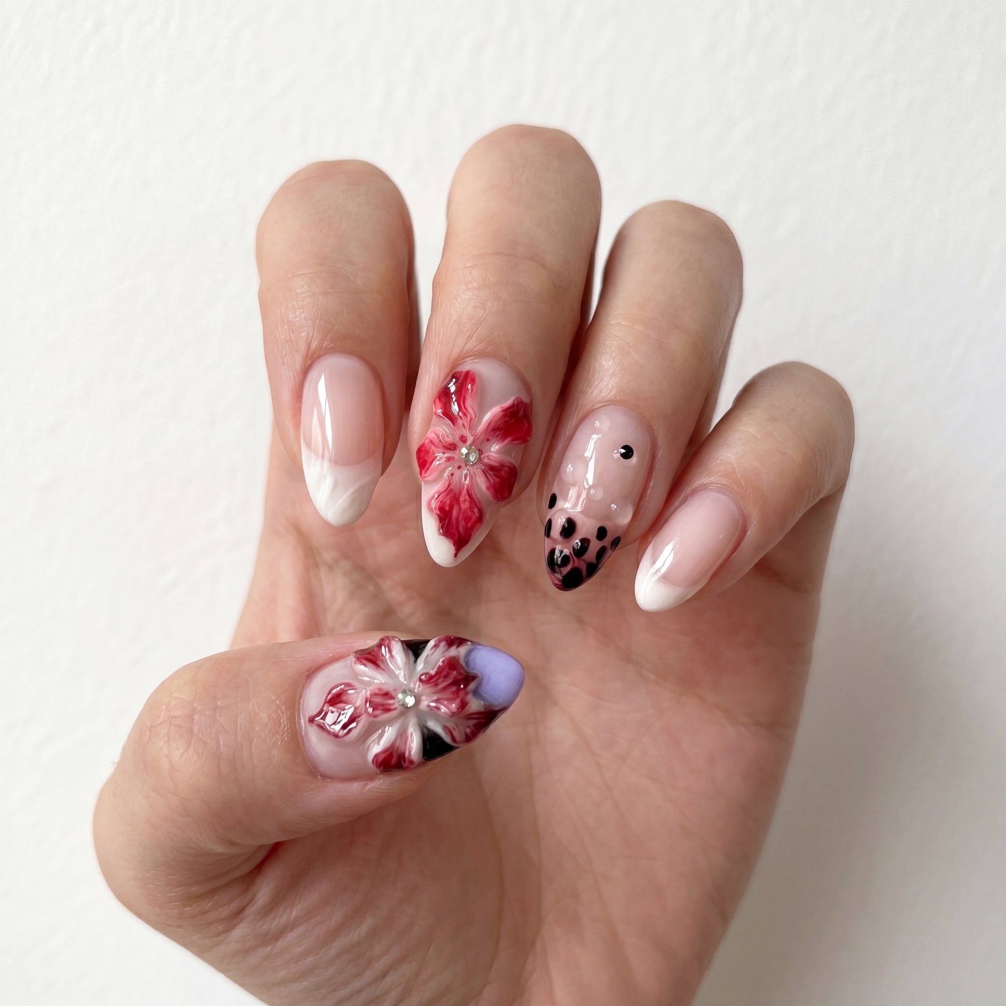 Crimson Lily press-on nails on hand 2