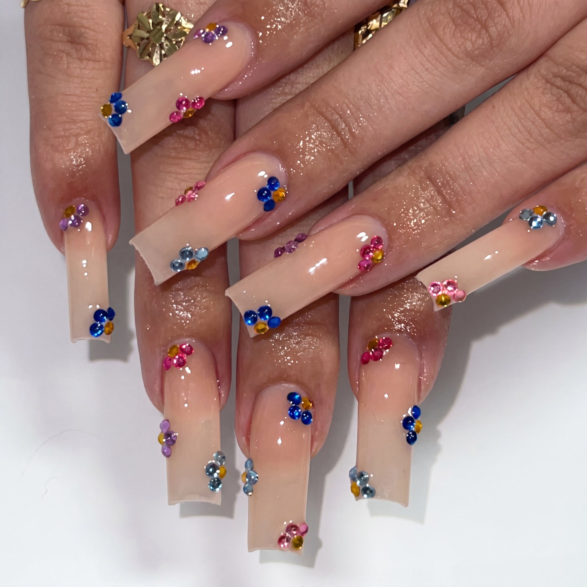 Gem Drop Nude press-on nails on hand
